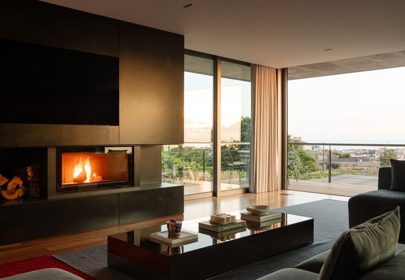 Living room with fireplace and sea view